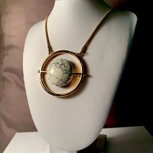 Long gold colored necklace